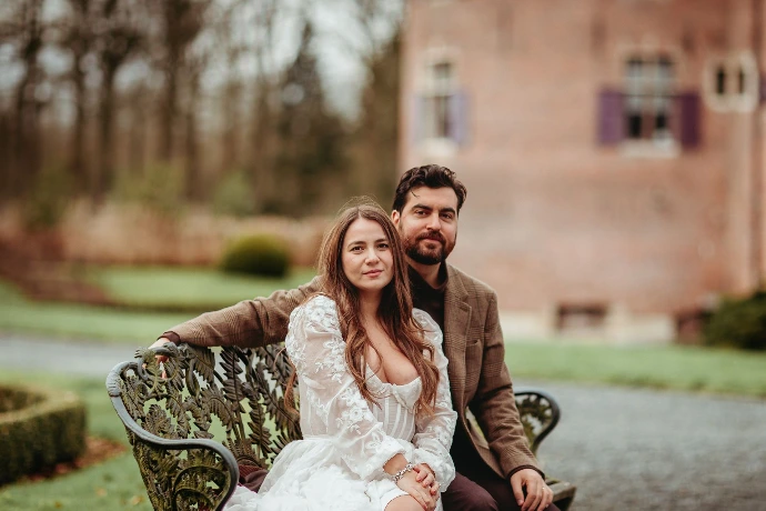 Romantic anniversary photoshoot of an American couple walking near Ooidonk Castle.